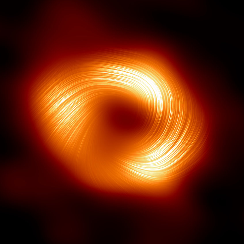 yellow-red glowing blurred ring with a spiral stripe pattern against a black background